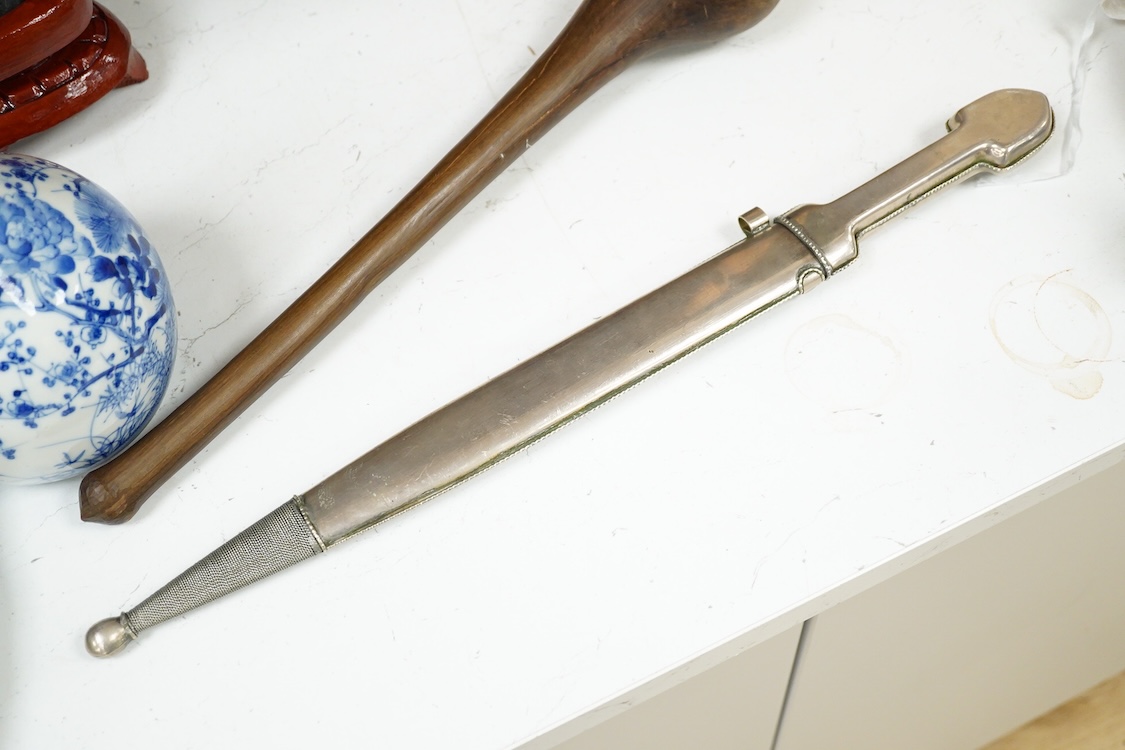 An African hardwood throwing club together with a painted mask and a Caucasian style dagger kindjal, largest 34cm high